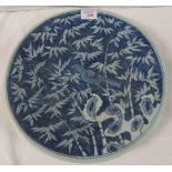 Chinese or Japanese porcelain dish decorated in underglaze blue with bird in bamboo branches, height