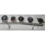 Five car badges mounted on a Desmo chromium bar - Sir Henry Royce Commemorative Rally France 1977,