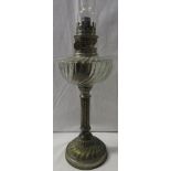 Oil lamp with clear glass reservoir and nickel plated reed column and mounts, circular foot,