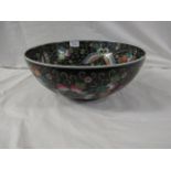 Large Chinese porcelain bowl, black ground, enamelled in the famille rose palette to the interior