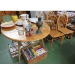 ERCOL LIGHT ELM DROP LEAF CIRCULAR DINING TABLE AND FOUR WHEEL BACK CHAIRS