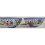 A pair of Chinese eggshell porcelain bowls, enamelled in the famille rose palette with courtiers