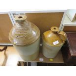 TWO STONEWARE FLAGONS, ONE STAMPED G. TAYLOR SPIRIT MERCHANT WEST HARTLEPOOL (A/F)