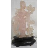Carved rose quartz figure of Guanyin with robes and foliage with carved hardwood base, height