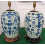 A pair of Chinese porcelain celadon glaze table lamps, ovoid, each decorated to one half in