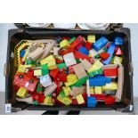 A collection of Wooden children's play items including vehicles, train set, buildings.