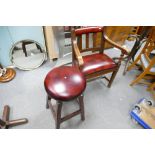 20th Century oak arm chair with barley twist stretcher and oxblood leather seating and a stained