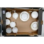 A collection of Minton Gold Laurentiam patterned dinner ware to include cups, saucers, milk jugs,