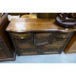 20th Century decorative carved oak sideboard with overhanging drawers