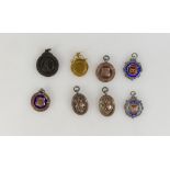 8 Fobs / medallions - 6 x silver (50.4g) 1 x gold (3.
