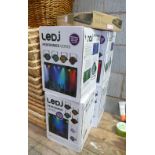 A set of 4 LEDJ proformance series disco lights with a insignia DVD player and a collection of