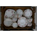 A collection of early Coalport tea and dinner ware with hand decorated floral decoration to include