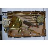 A collection of brass ware items to include fireside set, hearth dogs, etc.