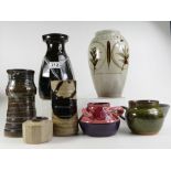 A collection of vintage studio art pottery including Peter Lake cut sided vase,