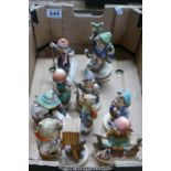 A collection of Goebel Hummel figures to include boy with camera, Just resting, Boy with rabbits,