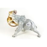Italian pottery figure of a tiger fighting large elephant (damage to tusk)