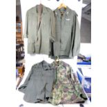 A collection of Army uniform items to inlcude shirts and camoflage jacket (4)