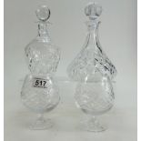 A collection of lead crystal items to include two decanters with stoppers and two brandy glasses
