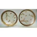 A pair of Cauldon cabinet plates,19th/20th century, decorated with gilded birds & foliage,