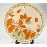 A Charlotte Rhead crown ducal charger in the golden leaves design