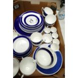 A collection of undecorated blue and white dinner and tea ware