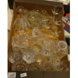 A collection of pressed and cut glass items to include drinking vessels, Babycham brandy glassware,
