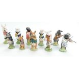 A collection of Beswick Pig Promenade figures comprising Daniel PP5, George PP10, Richard PP8,