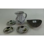A collection of studio ware items to include Dingwall candlesticks, graduated candlesticks and jug,