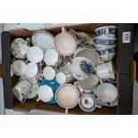 A mixed collection of items to include decorative floral designed cups and saucers,