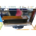 Panasonic Viera small television with remote control and matching tv stand