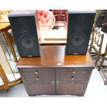 A mahogany record player unit with a 3-part Sanyo stereo system and record player,
