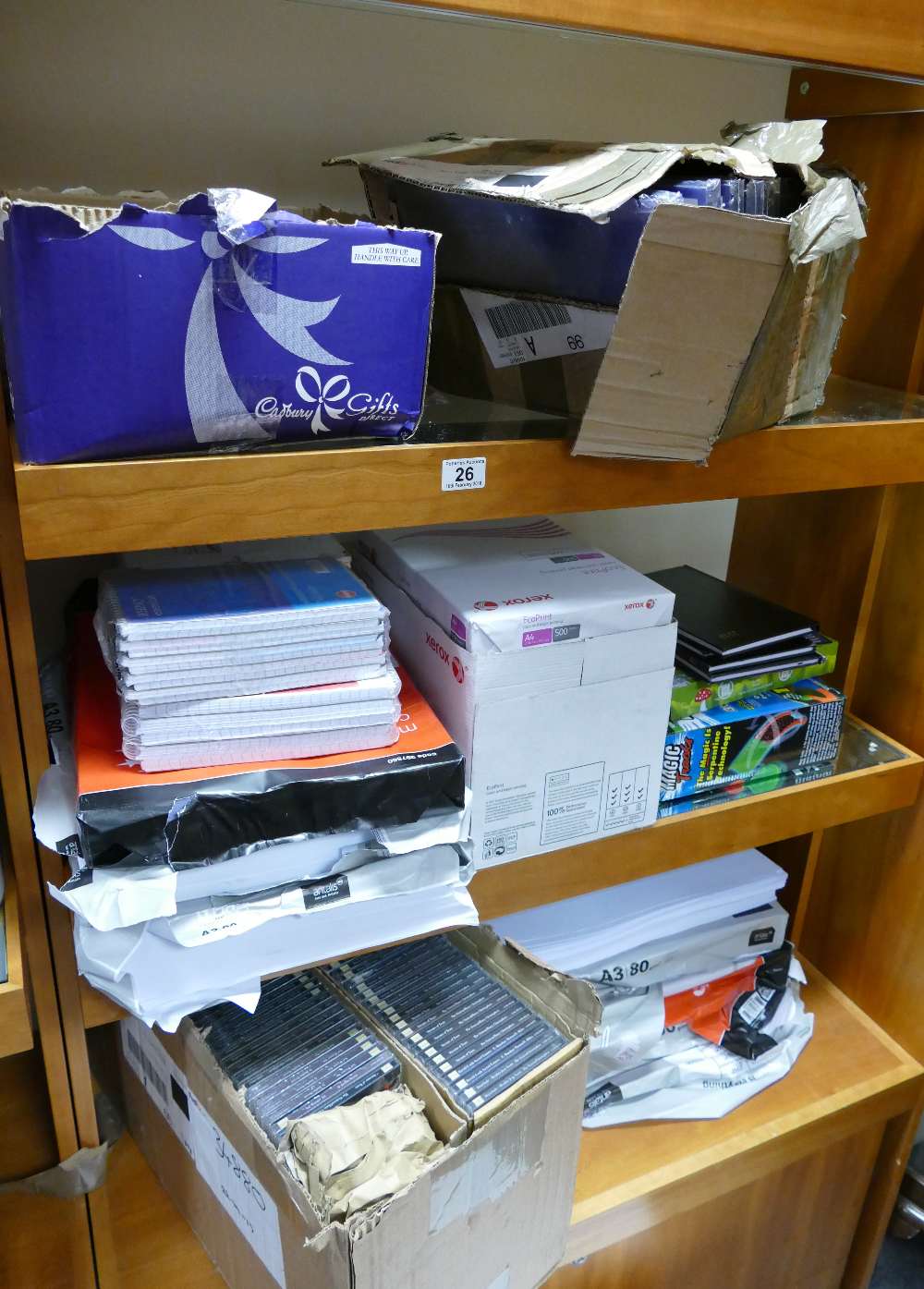 A large mixed collection of office supplies to include - A4 paper, Rhino and Euro office notepads,