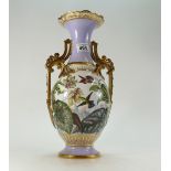 Large Porcelain two handled vase gilded and handpainted with humming birds,