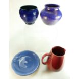 A collection of early William Moorcroft pottery items including Flamminian jug, lustred ribbed vase,
