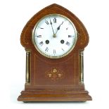 Art Nouveau mahogany inlaid mantle clock with brass columns,