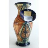 Moorcroft vase decorated with orange lilies by Debbie Hancock, dated 2000, height 19.5cm, boxed.