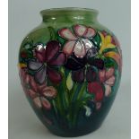 Walter Moorcroft vase decorated in the Spring Flowers design, height 16.