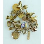 9ct Gold Charm Bracelet with large quantity of 9ct gold charms.