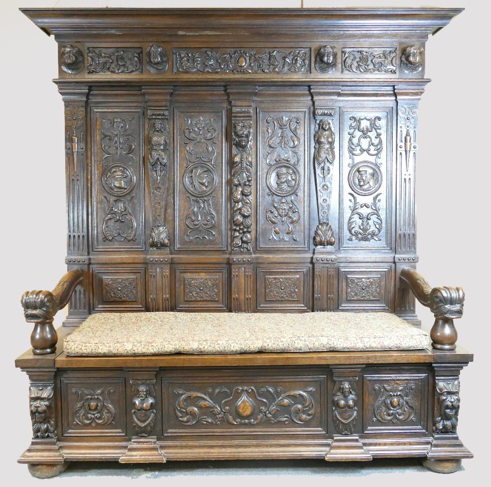 Early 20th century large carved oak double hall seat, length 198cm height 194cm depth 60cm.