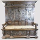 Early 20th century large carved oak double hall seat, length 198cm height 194cm depth 60cm.