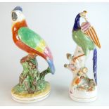 19th century Staffordshire figure of a Bird of Paradise on a branch with a chick and nest,