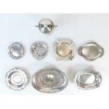 A collection of silver items including dishes, ashtrays, two handled trophy & cover etc.