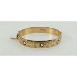 9ct gold decorated bangle set with seed pearls, 34 grams.