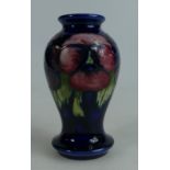 Moorcroft small vase decorated in the Pansy design, height 10.