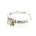 18ct White gold ring set with a centre square diamond surrounded by 22 small diamonds, size O, 3.