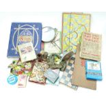A collection of old vintage items including a Victorian scrapbook, games, old boxed jigsaws,
