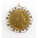 Gold Full Sovereign dated 1909 in 9ct Rose gold mount, 9.6 grams.