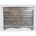 Early 19th century panelled oak two drawer coffer, w115 x d58 x h99cm.