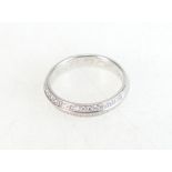 18ct gold eternity ring set with diamonds, size I, 3.4 grams.