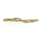 18ct gold bracelet set with twenty four diamonds, 15.8 grams, unmarked but tested as 18ct gold.